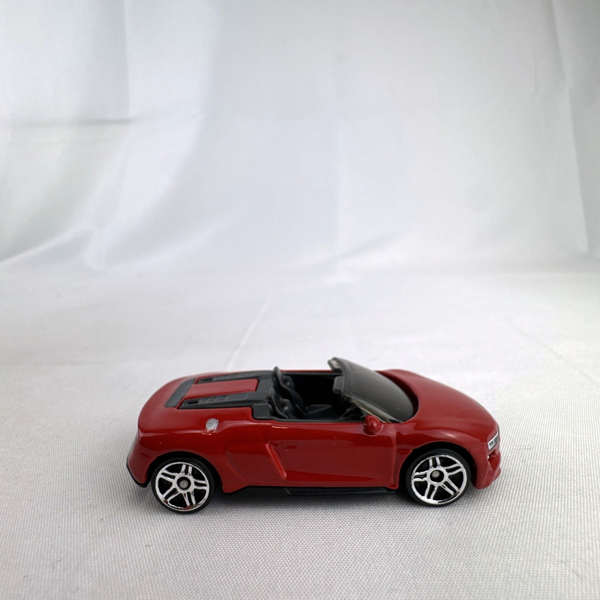 Hot Wheels 1:64 scale 2019 Audi R8 Spyder diecast convertible in red with chrome-spoke wheels