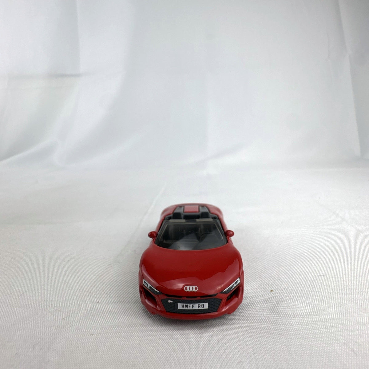 Hot Wheels 1:64 scale 2019 Audi R8 Spyder diecast convertible in red with chrome-spoke wheels