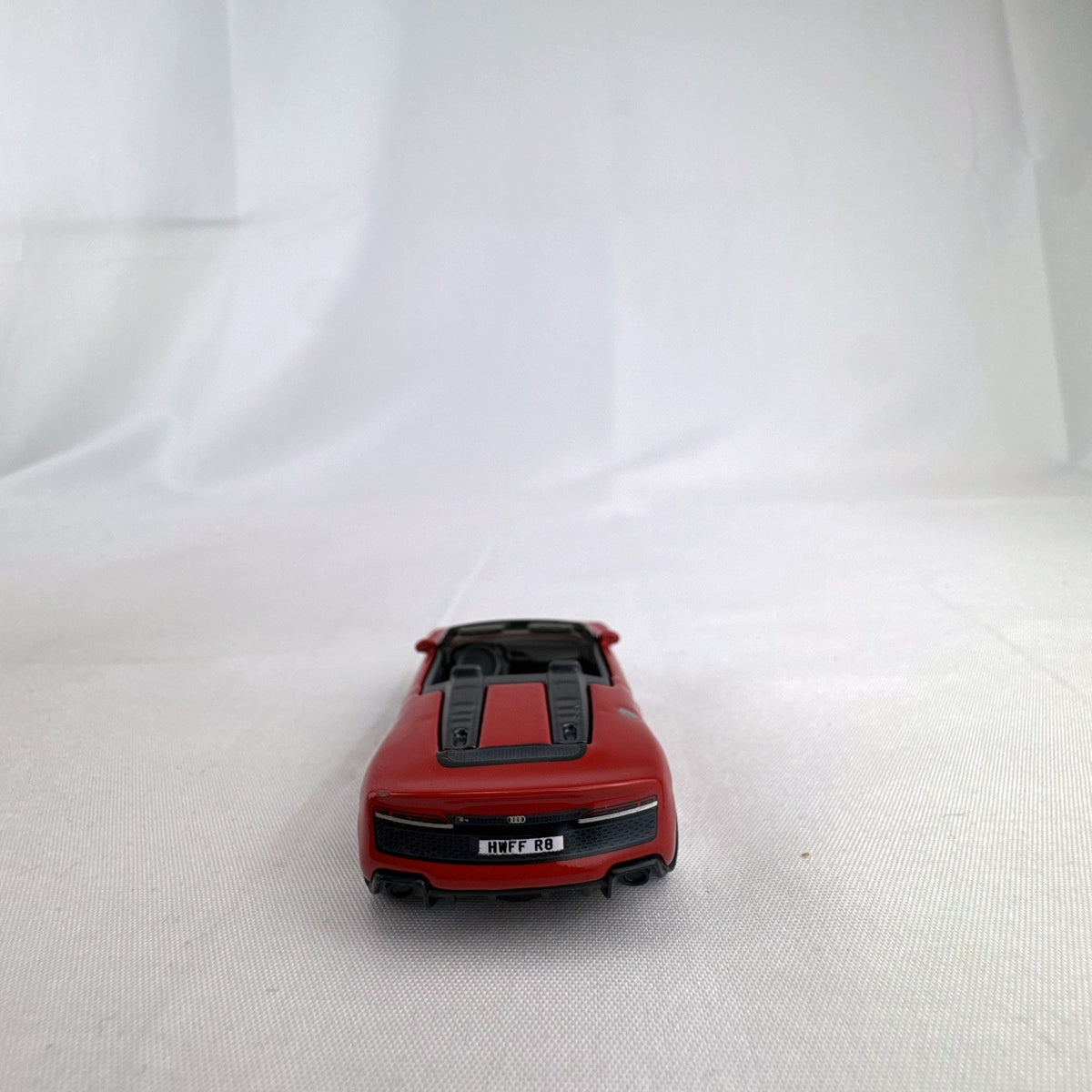 Hot Wheels 1:64 scale 2019 Audi R8 Spyder diecast convertible in red with chrome-spoke wheels