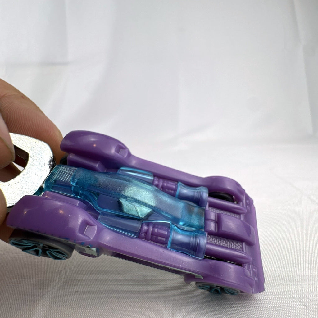 Hot Wheels Experimotors Tooligan 1:64 scale diecast car in purple with integrated wrench tail