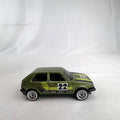 Hot Wheels 1:64 scale Volkswagen Golf Mk2 diecast car in metallic olive green with Castrol racing livery.