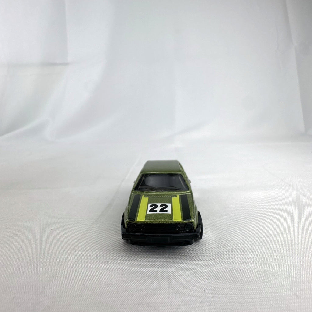 Hot Wheels 1:64 scale Volkswagen Golf Mk2 diecast car in metallic olive green with Castrol racing livery.