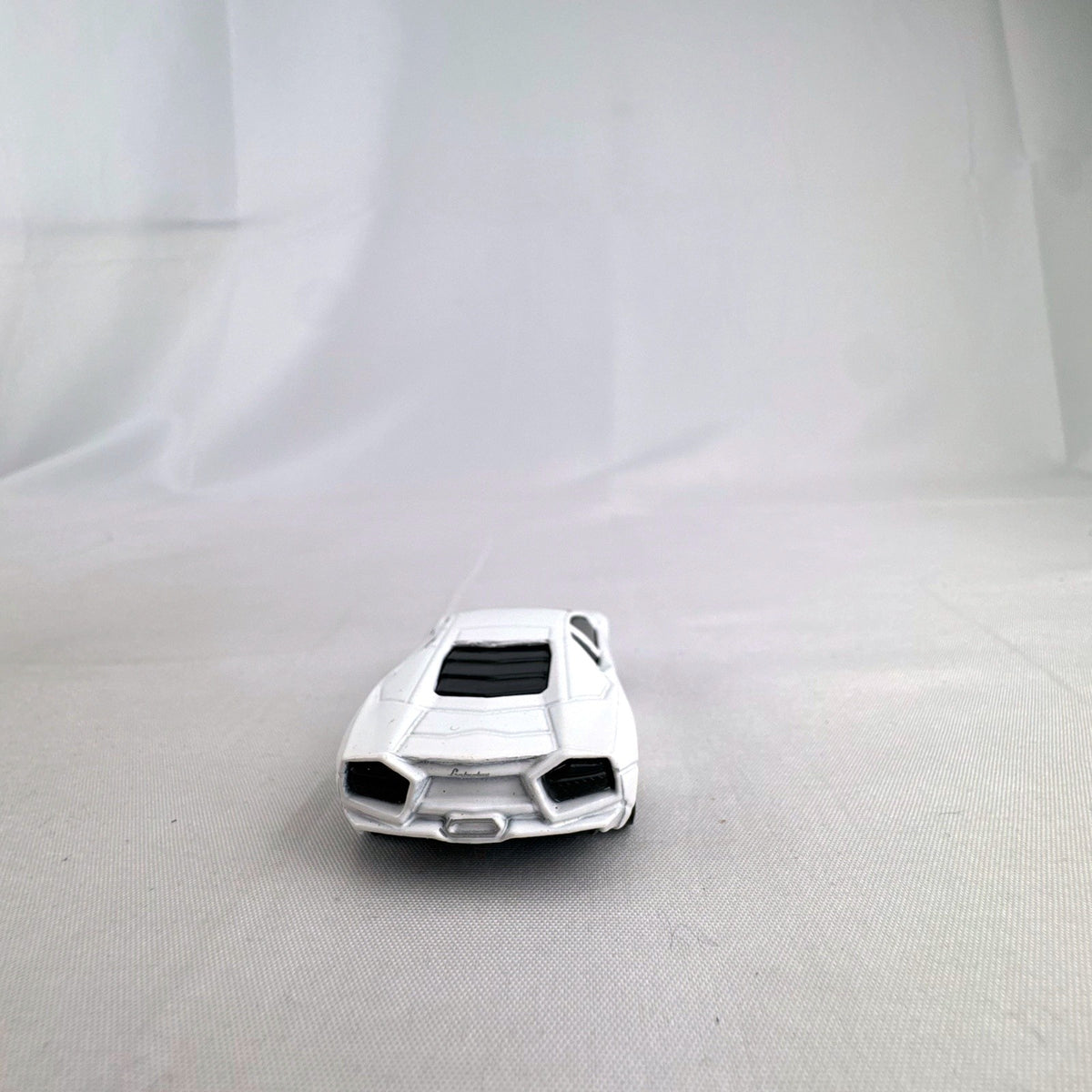 White Hot Wheels 1:64 scale diecast Lamborghini Reventón loose model car