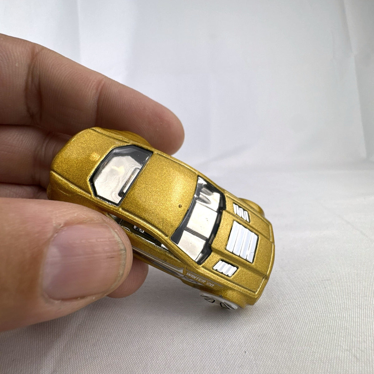 Hot Wheels 1:64 scale Torque Twister diecast car in gold from the 2020 Winter Series