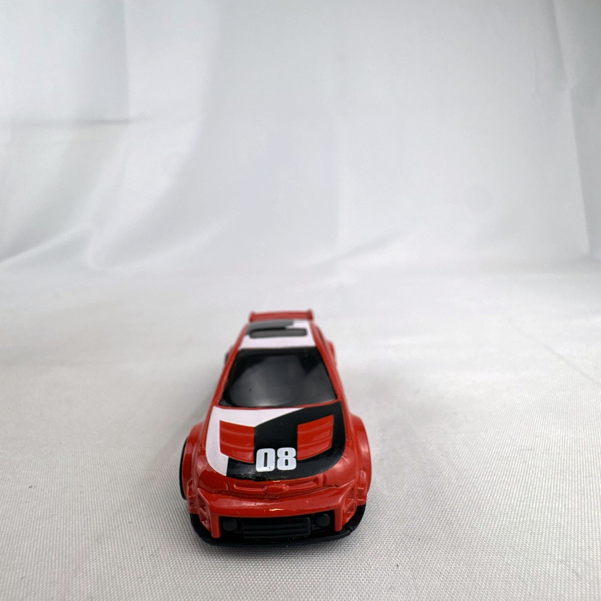 Hot Wheels 1:64 scale 2008 Ford Focus diecast rally car in red with Ford Racing graphics