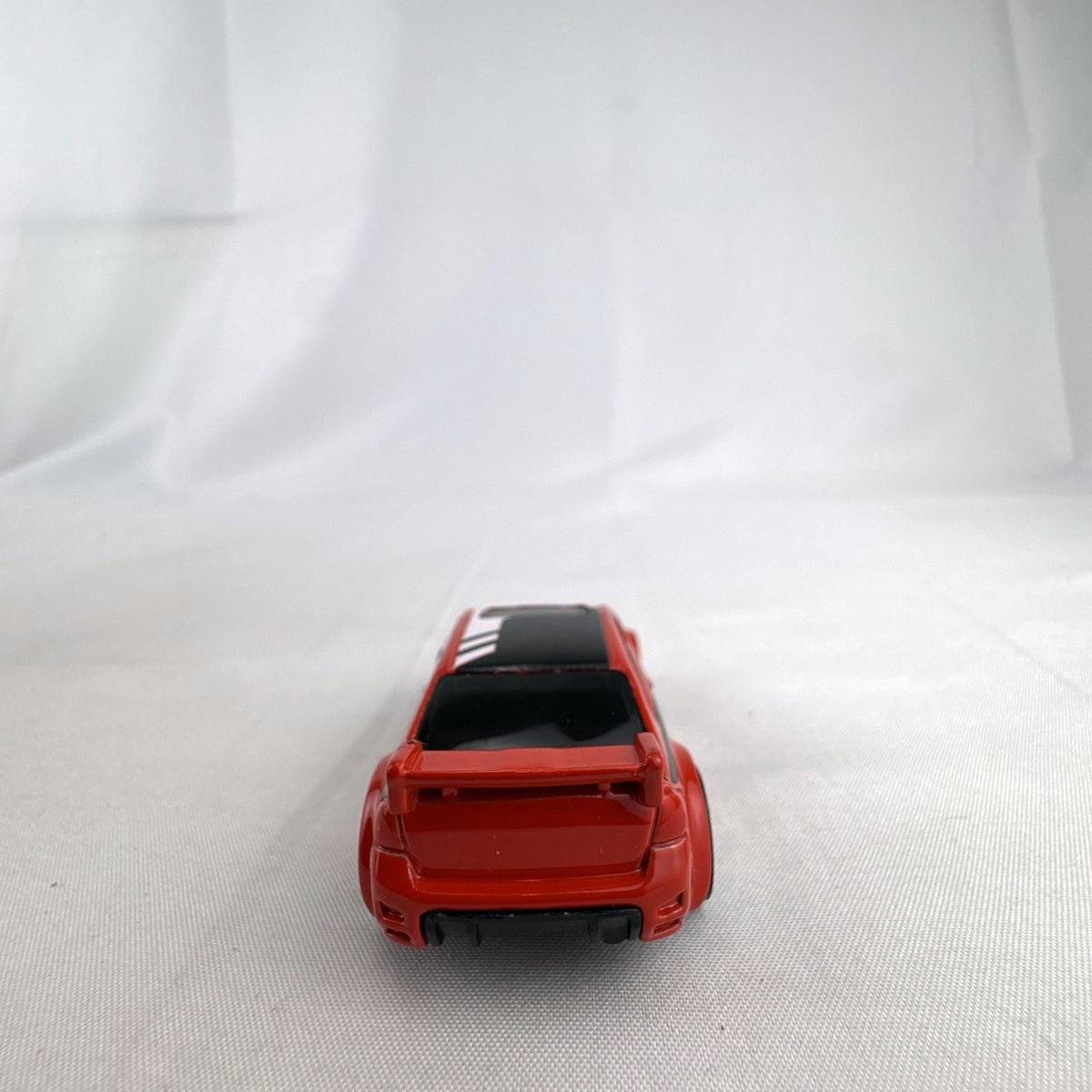 Hot Wheels 1:64 scale 2008 Ford Focus diecast rally car in red with Ford Racing graphics