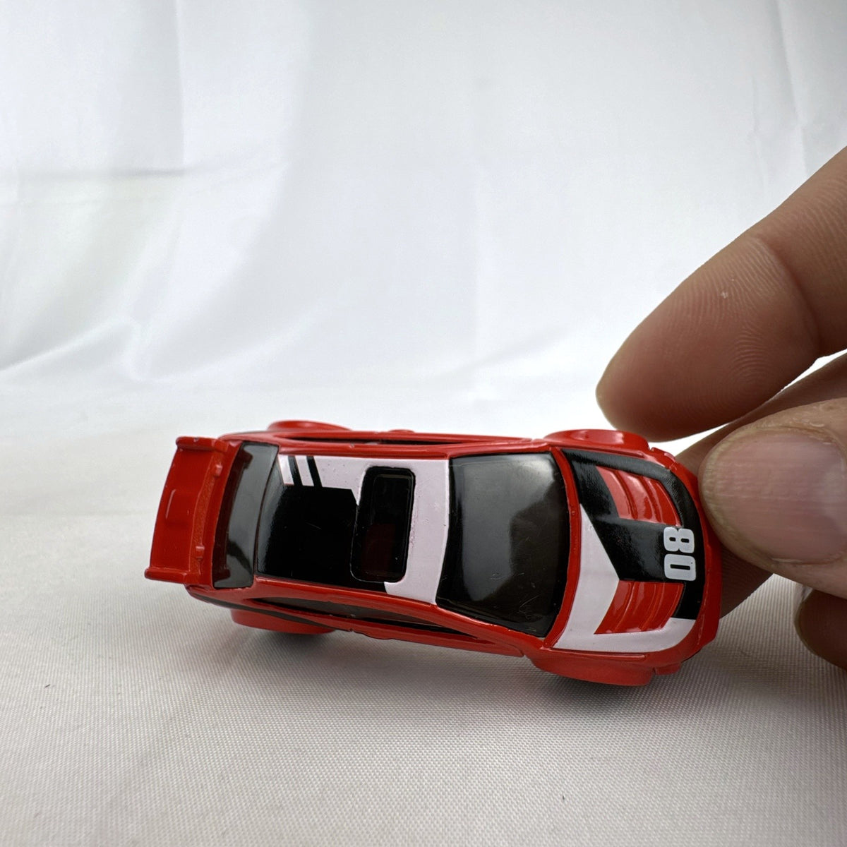 Hot Wheels 1:64 scale 2008 Ford Focus diecast rally car in red with Ford Racing graphics