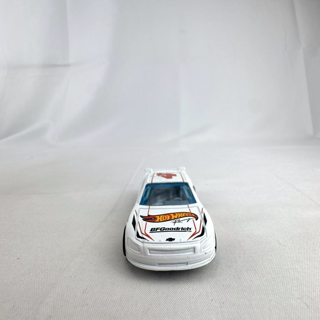 Hot Wheels 1:64 scale 2010 Chevrolet Impala stock car in white with number 4 racing livery