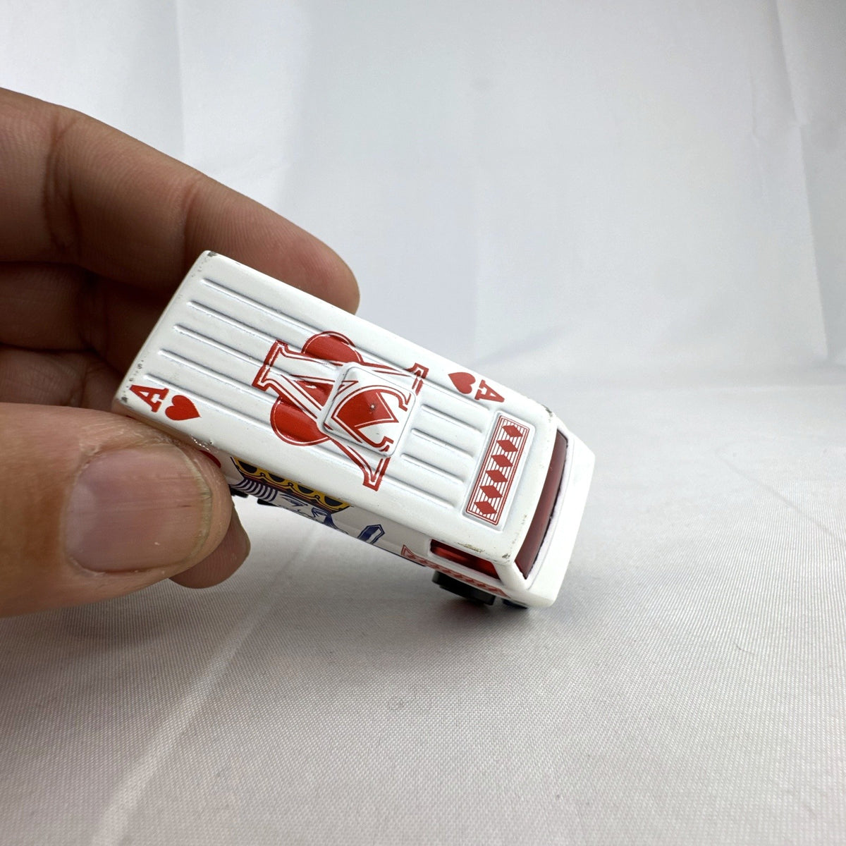 Hot Wheels 1:64 scale Super Van diecast vehicle featuring white King of Hearts playing card graphics