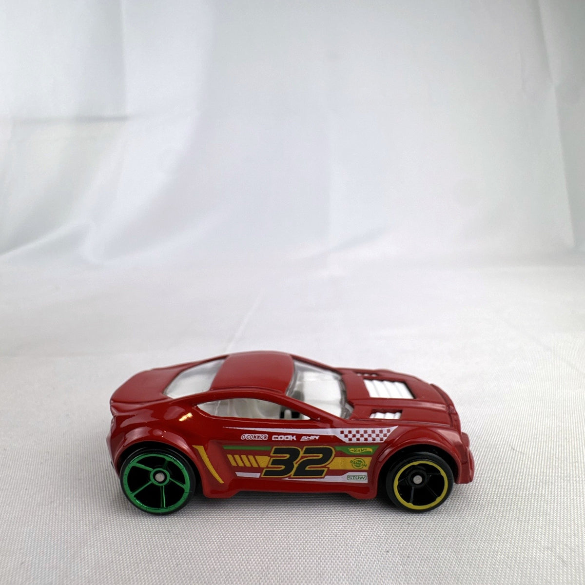 Red Hot Wheels Torque Twister 1:64 scale diecast car with number 32 racing graphics