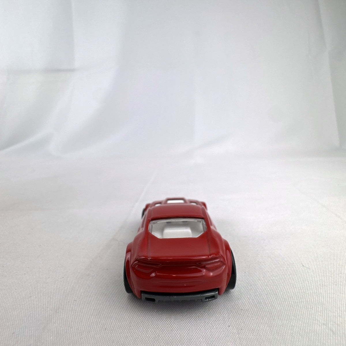 Red Hot Wheels Torque Twister 1:64 scale diecast car with number 32 racing graphics