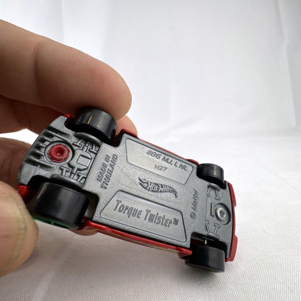 Red Hot Wheels Torque Twister 1:64 scale diecast car with number 32 racing graphics