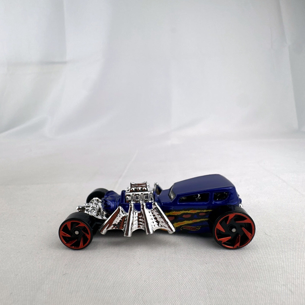 Blue Hot Wheels Street Creeper 1:64 scale diecast car featuring chrome spider engine block