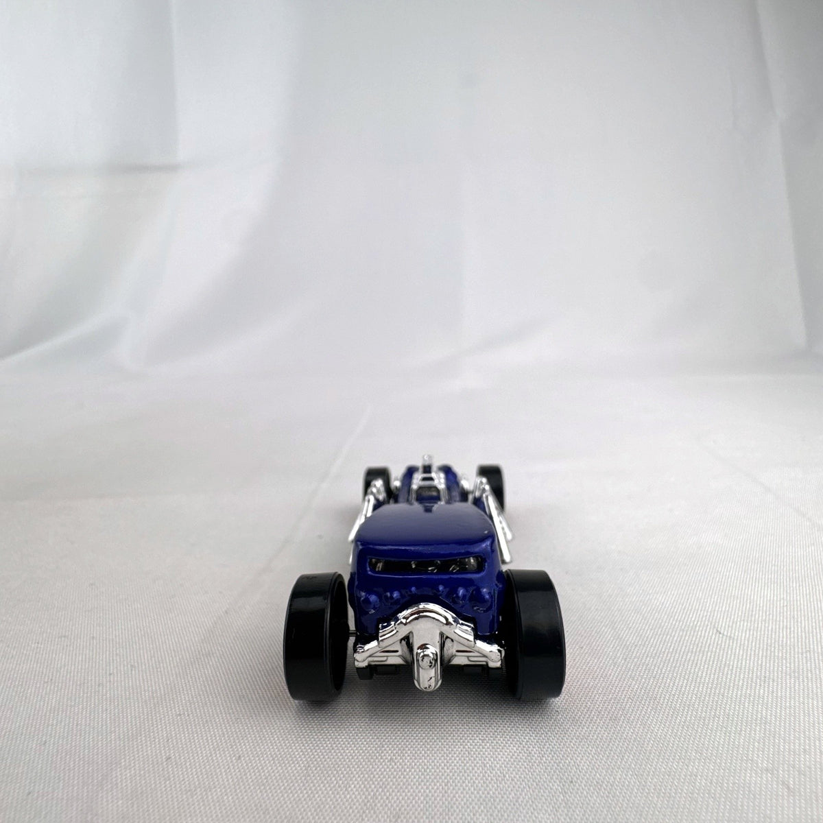 Blue Hot Wheels Street Creeper 1:64 scale diecast car featuring chrome spider engine block