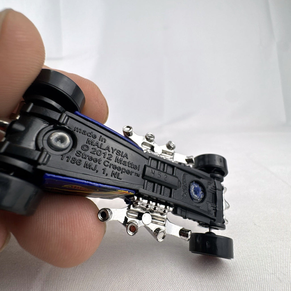 Blue Hot Wheels Street Creeper 1:64 scale diecast car featuring chrome spider engine block