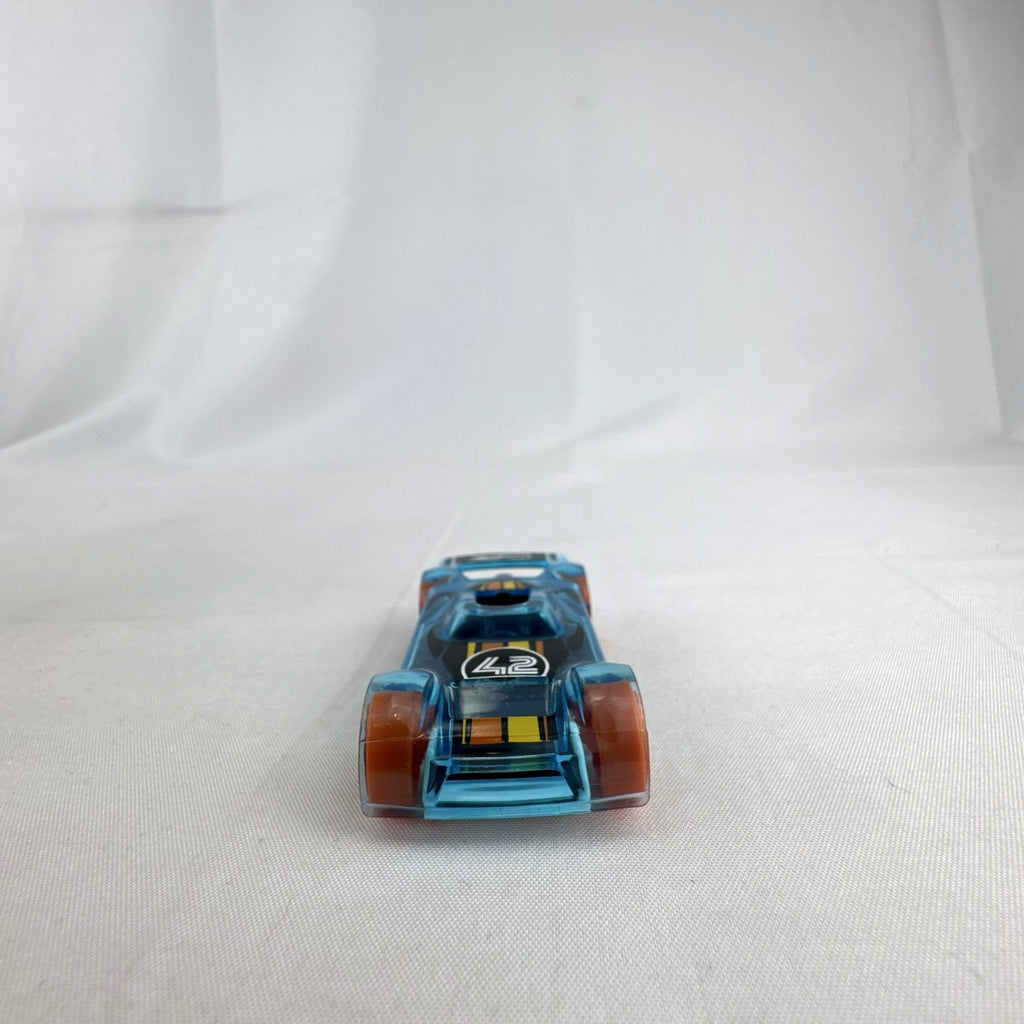 Hot Wheels Mach It Go 1:64 scale diecast race car in translucent blue with orange wheels and number 42 livery