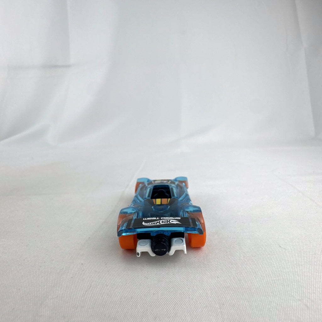 Hot Wheels Mach It Go 1:64 scale diecast race car in translucent blue with orange wheels and number 42 livery