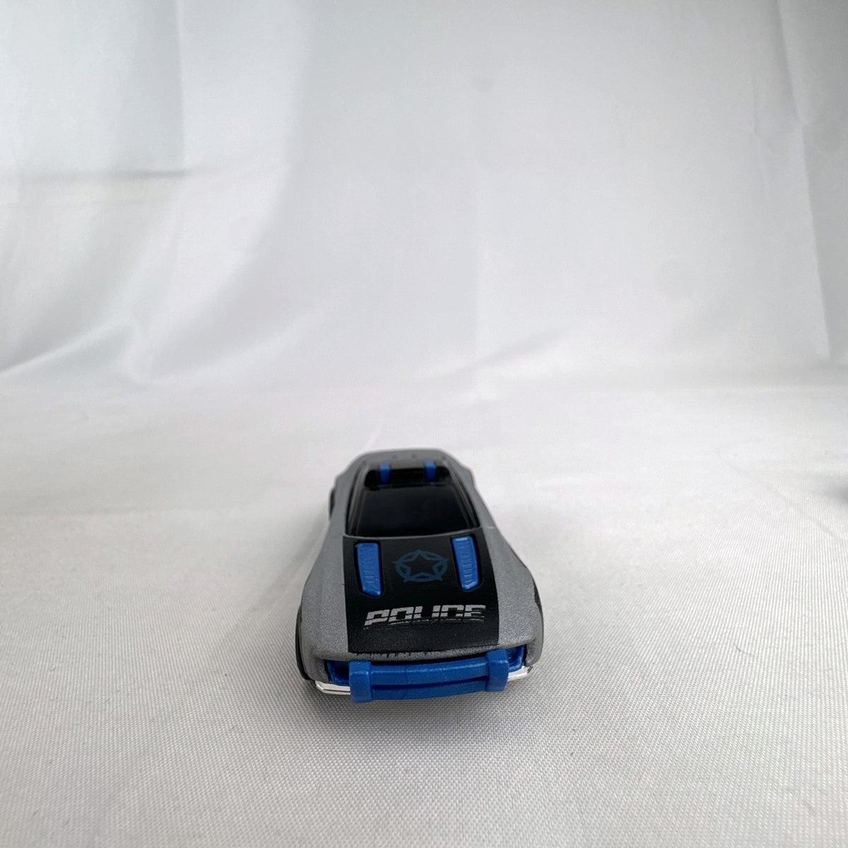 Hot Wheels Alpha Pursuit 1:64 scale police interceptor diecast car in metallic silver and black