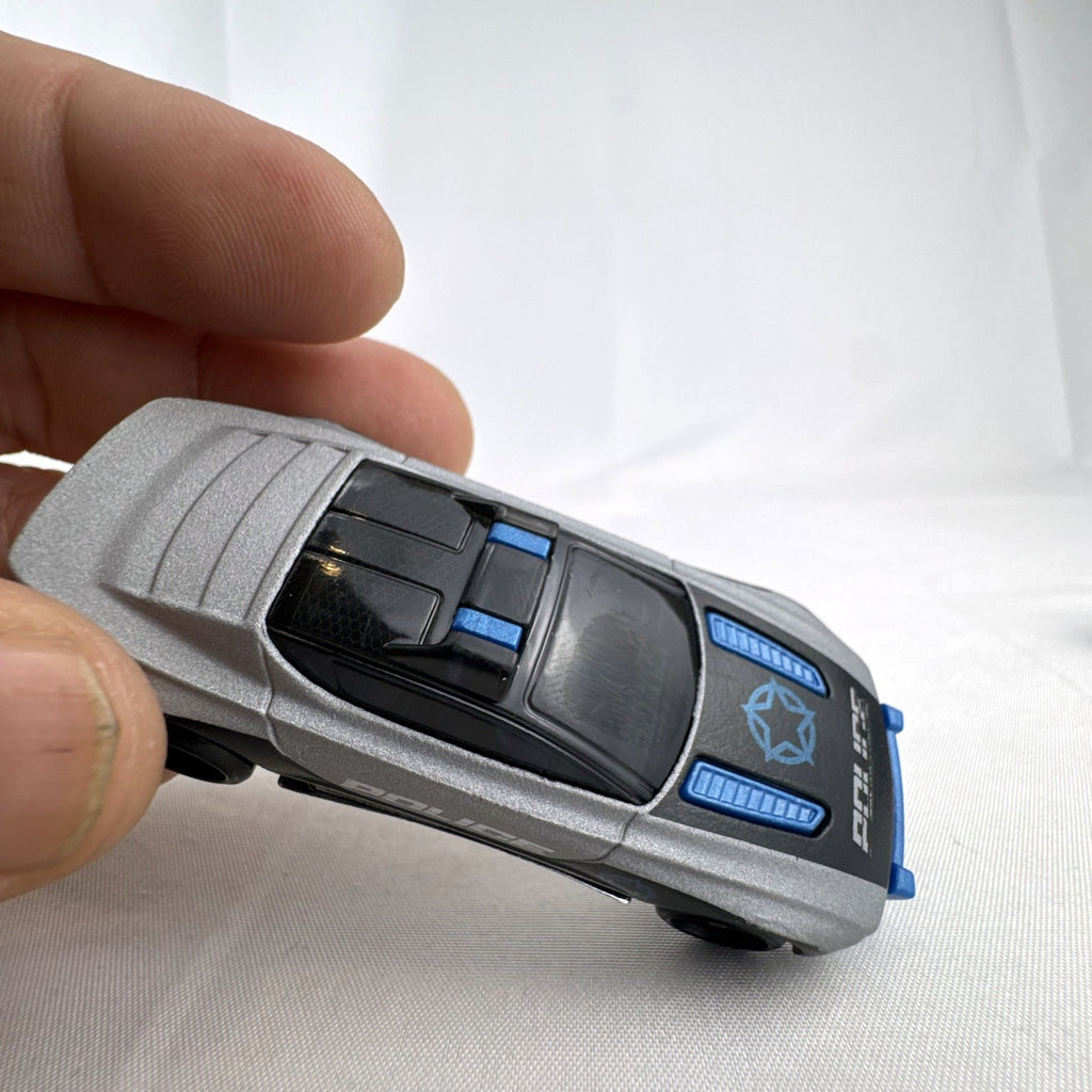 Hot Wheels Alpha Pursuit 1:64 scale police interceptor diecast car in metallic silver and black