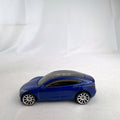 Hot Wheels 1:64 scale metallic blue Tesla Model 3 diecast car with smoke-tinted glass roof