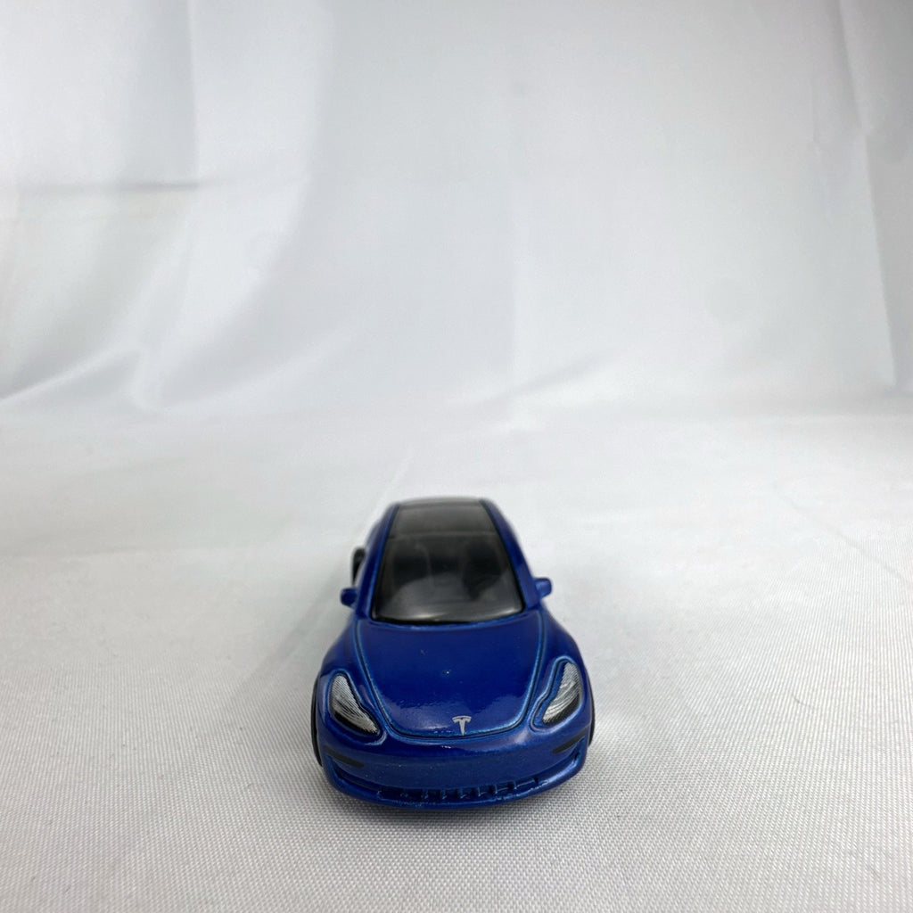 Hot Wheels 1:64 scale metallic blue Tesla Model 3 diecast car with smoke-tinted glass roof
