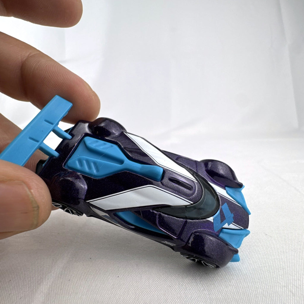 Hot Wheels Mach Speeder 1:64 scale diecast car in metallic purple with light blue accents