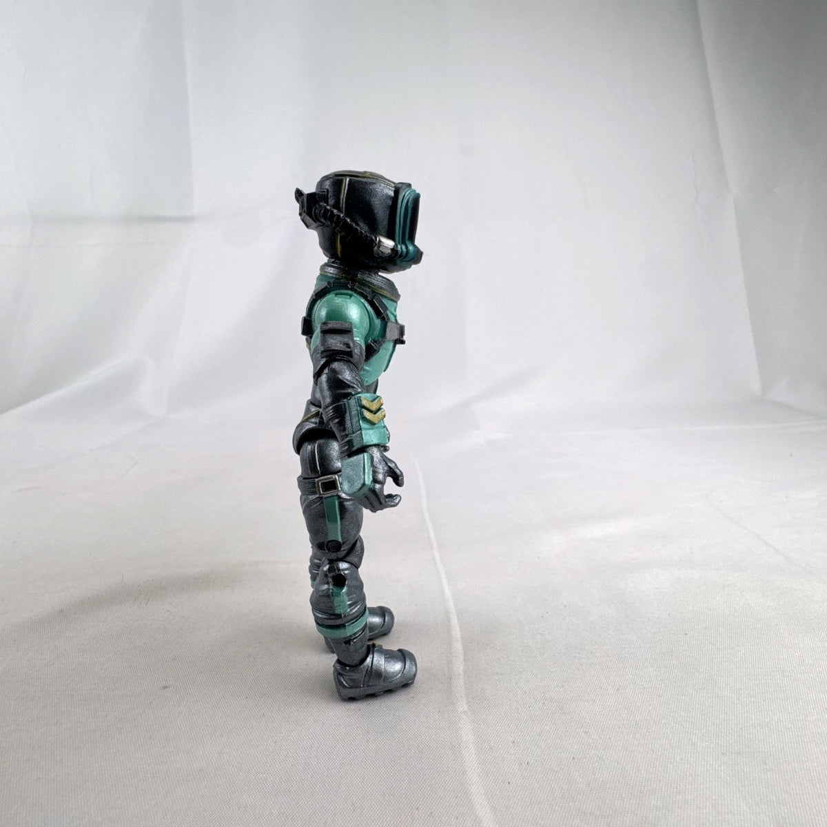 Jazwares Fortnite Eternal Voyager 4-inch plastic action figure in teal astronaut armor