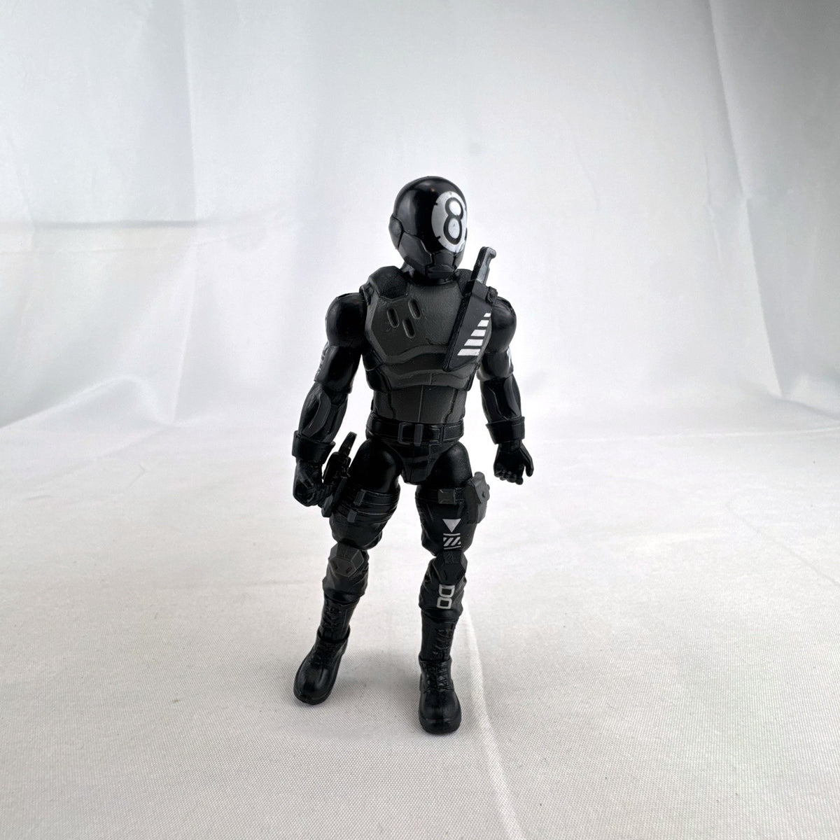 Jazwares Fortnite Solo Mode 4-inch 8-Ball action figure in black suit with back bling accessory