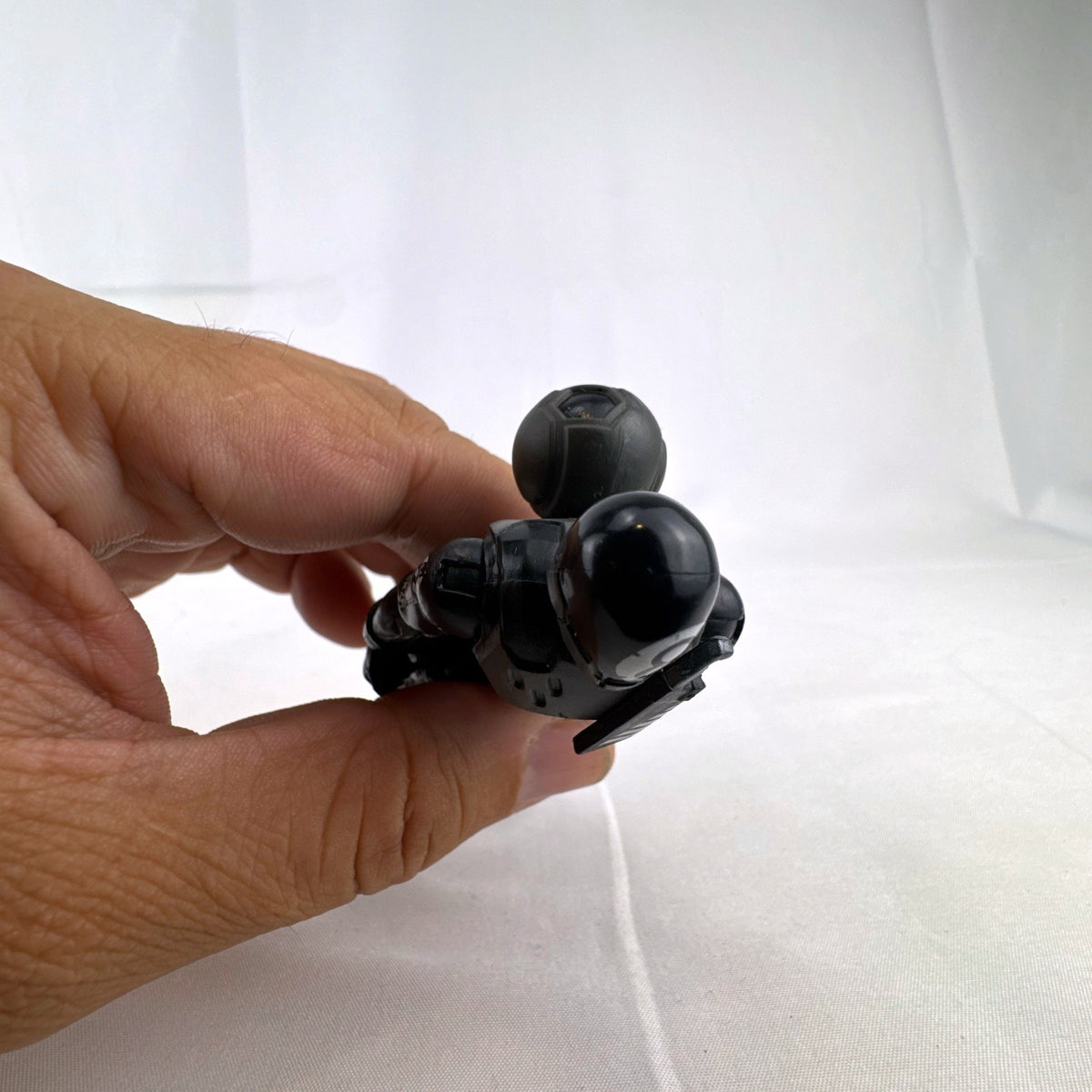 Jazwares Fortnite Solo Mode 4-inch 8-Ball action figure in black suit with back bling accessory