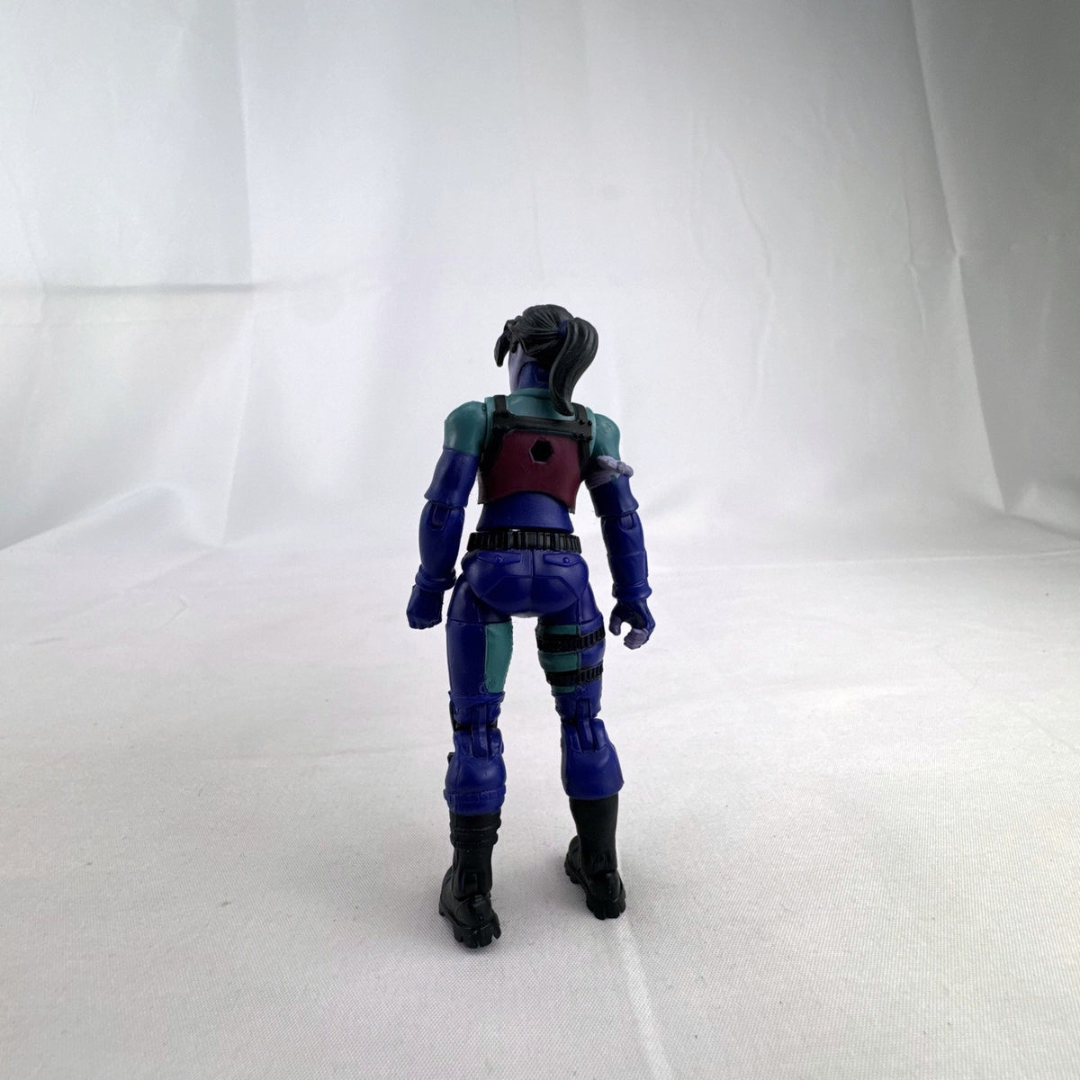 Jazwares Fortnite 4-inch Dark Bomber articulated action figure with purple detailing in loose condition