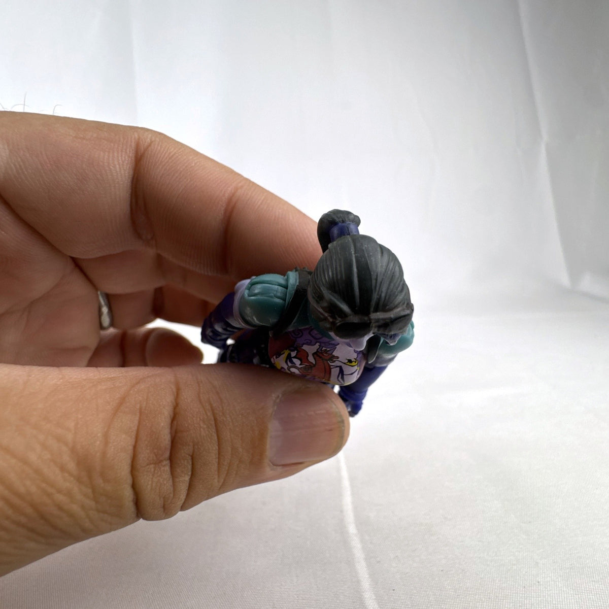 Jazwares Fortnite 4-inch Dark Bomber articulated action figure with purple detailing in loose condition