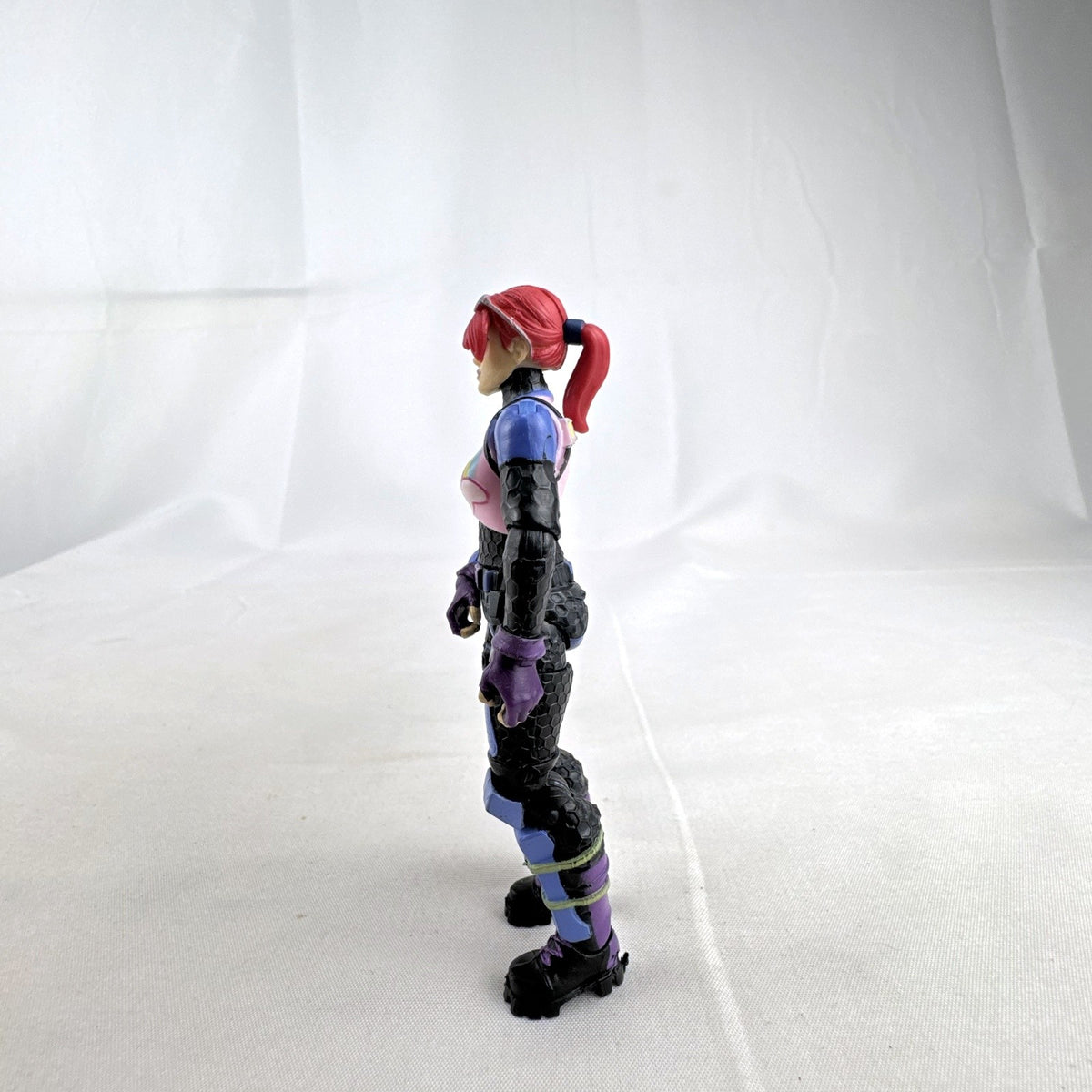 Jazwares Fortnite 4-inch Brite Bomber action figure with pink hair and unicorn chest design