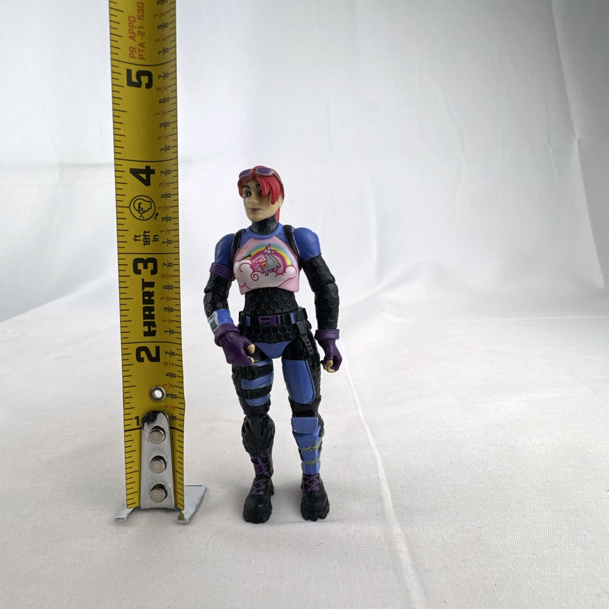 Jazwares Fortnite 4-inch Brite Bomber action figure with pink hair and unicorn chest design