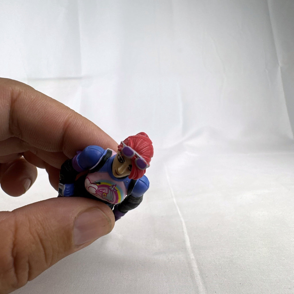 Jazwares Fortnite 4-inch Brite Bomber action figure with pink hair and unicorn chest design