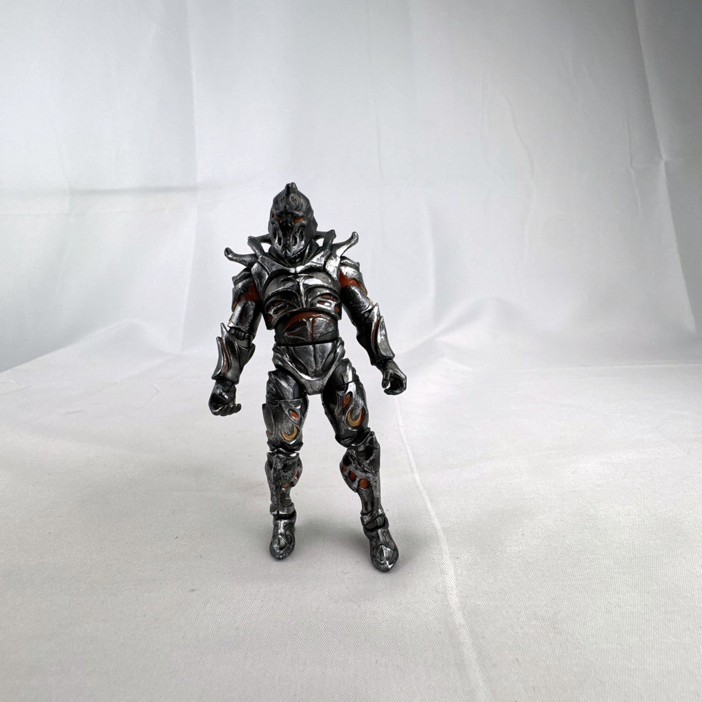 Jazwares Fortnite Ruin action figure with metallic armor and orange lava details.