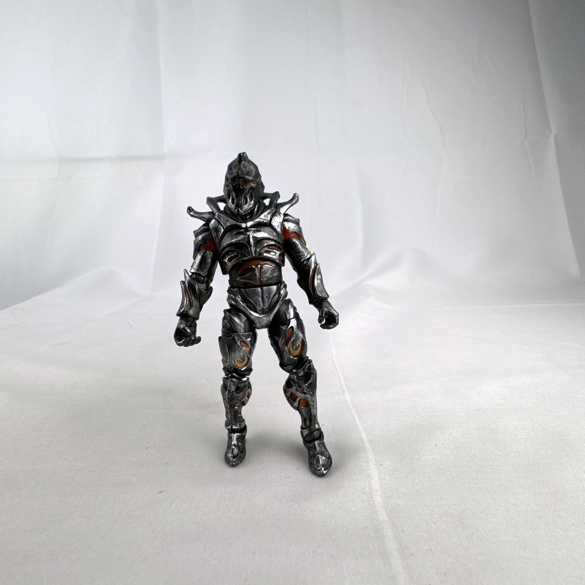 Jazwares Fortnite Ruin action figure with metallic armor and orange lava details.
