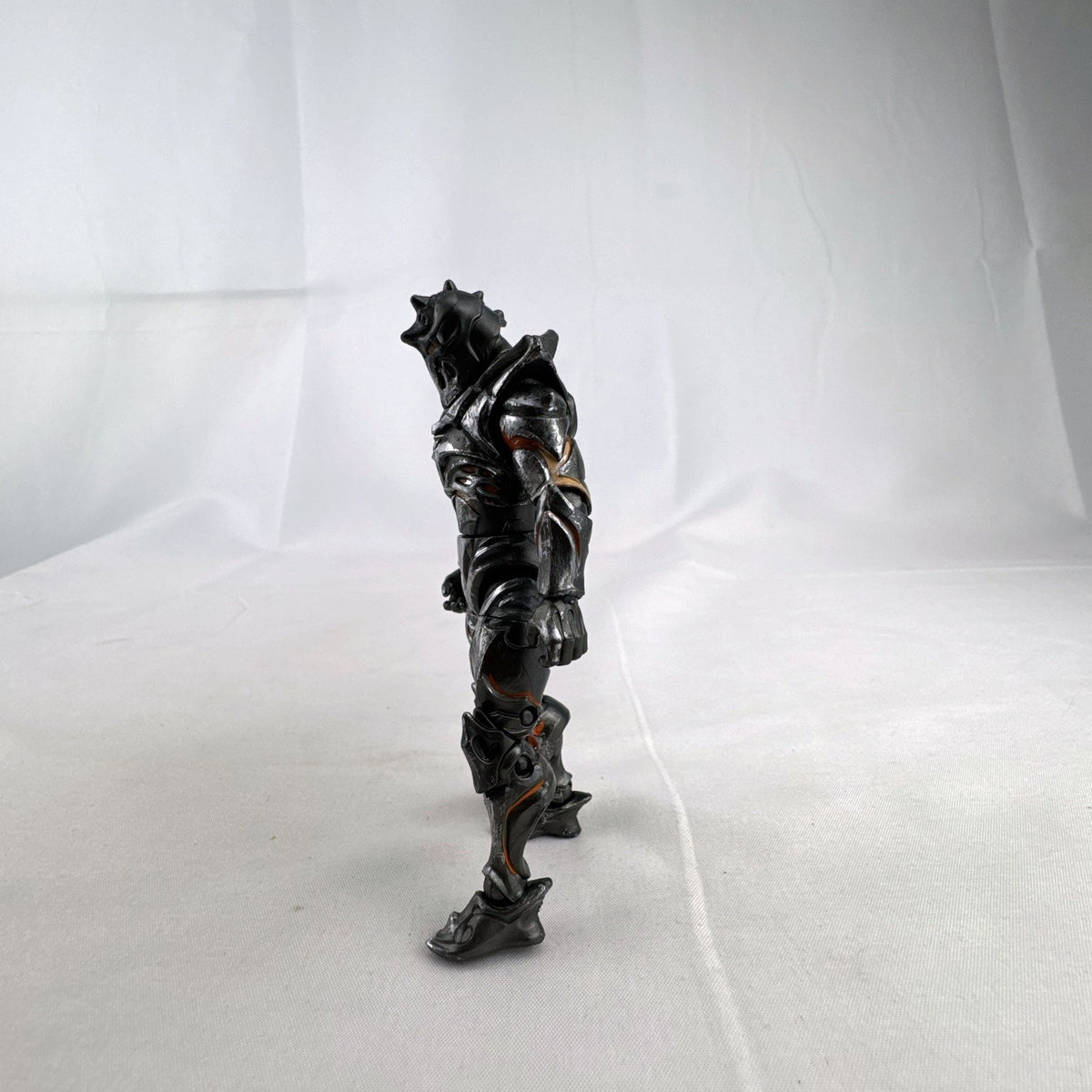 Jazwares Fortnite Ruin action figure with metallic armor and orange lava details.