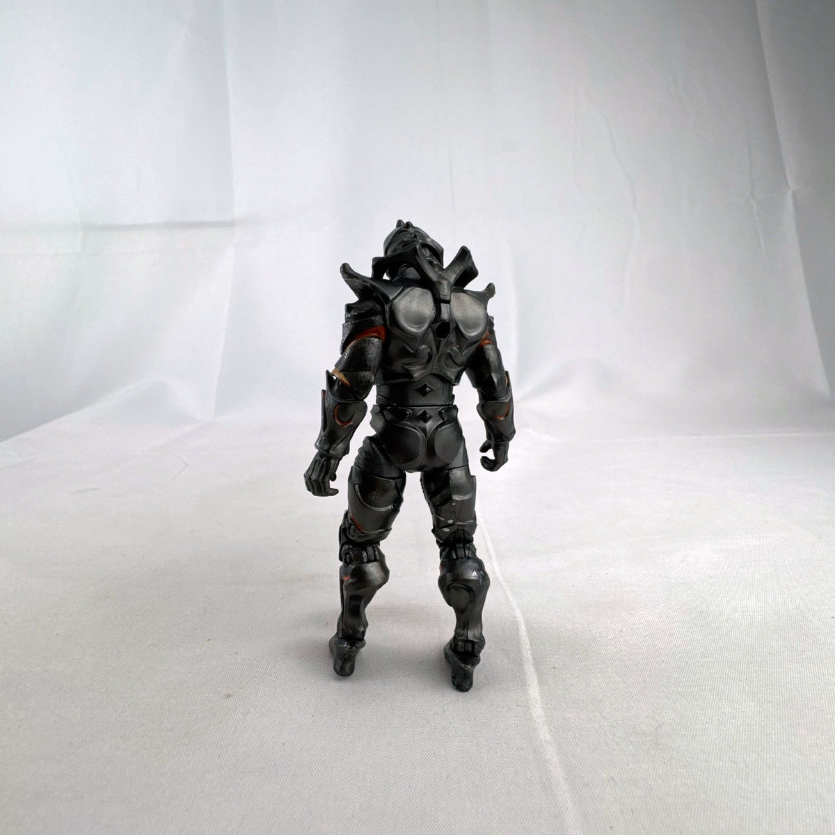 Jazwares Fortnite Ruin action figure with metallic armor and orange lava details.