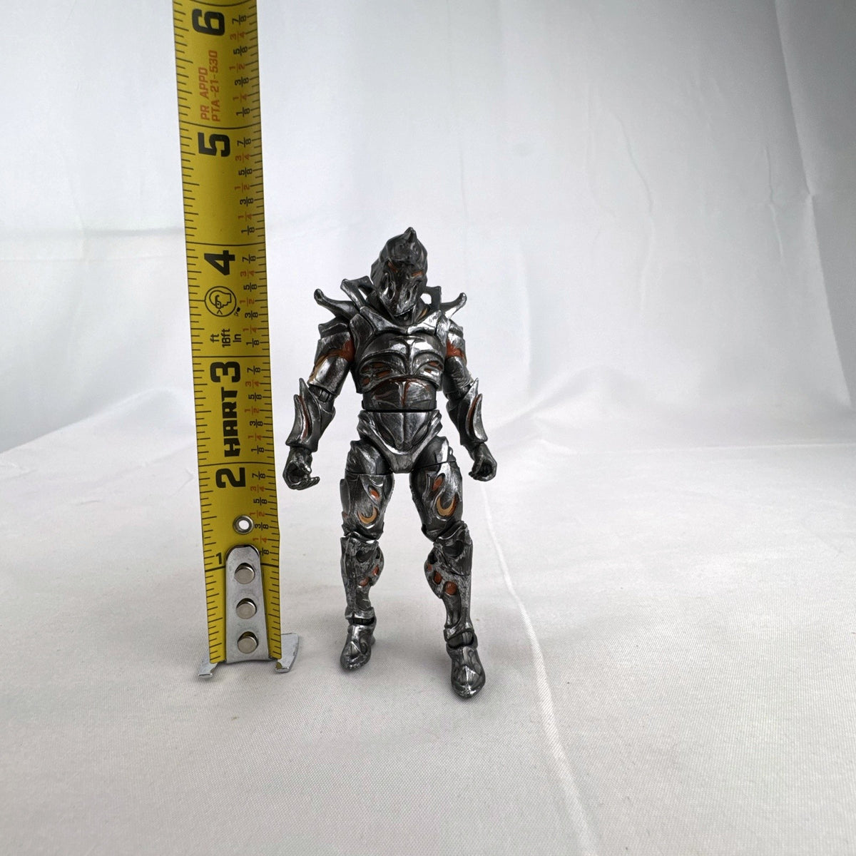 Jazwares Fortnite Ruin action figure with metallic armor and orange lava details.