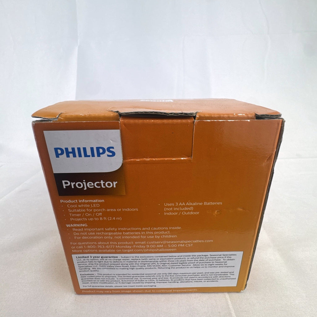 Philips black battery-operated Halloween LED projector casting a cool white skeleton light display.