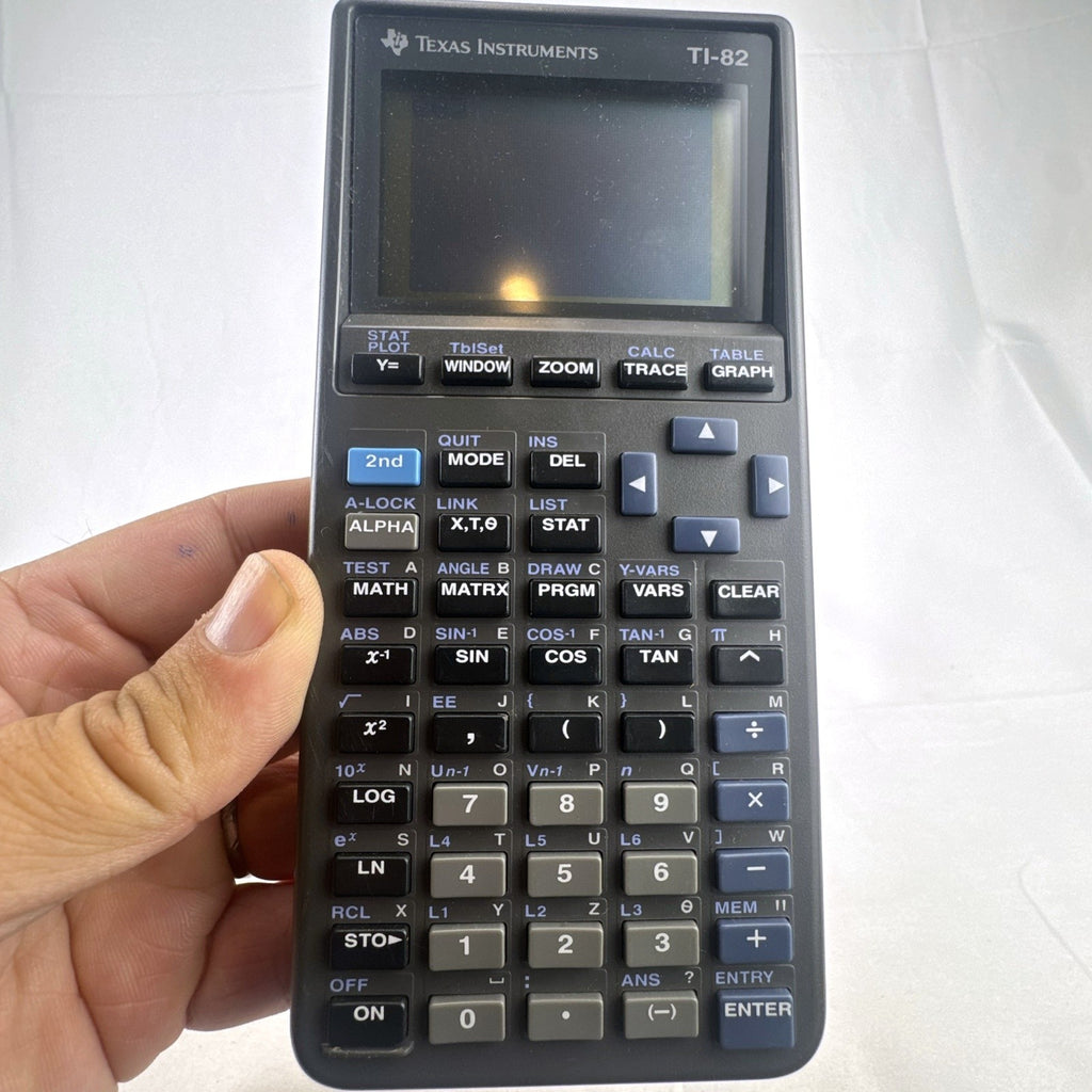 Texas Instruments TI-82 handheld graphing calculator in matte dark gray