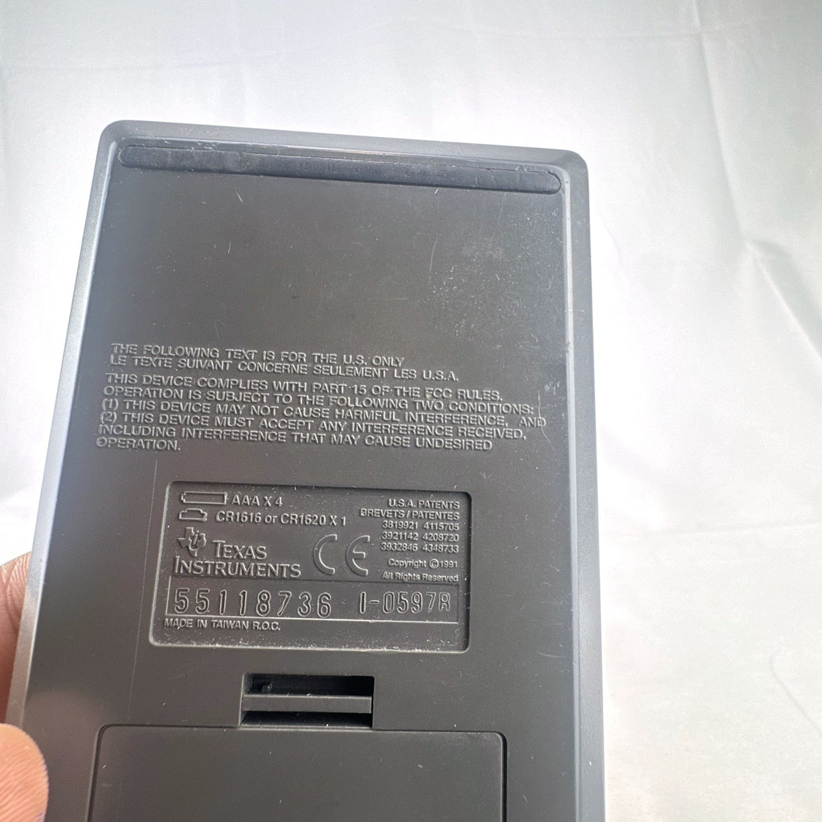 Texas Instruments TI-82 handheld graphing calculator in matte dark gray