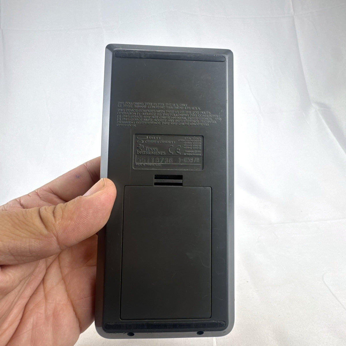 Texas Instruments TI-82 handheld graphing calculator in matte dark gray