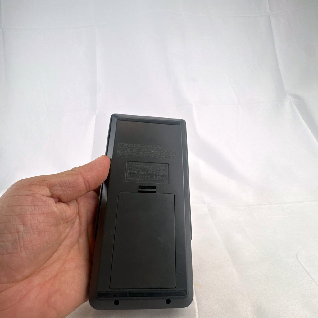 Texas Instruments TI-82 handheld graphing calculator in matte dark gray