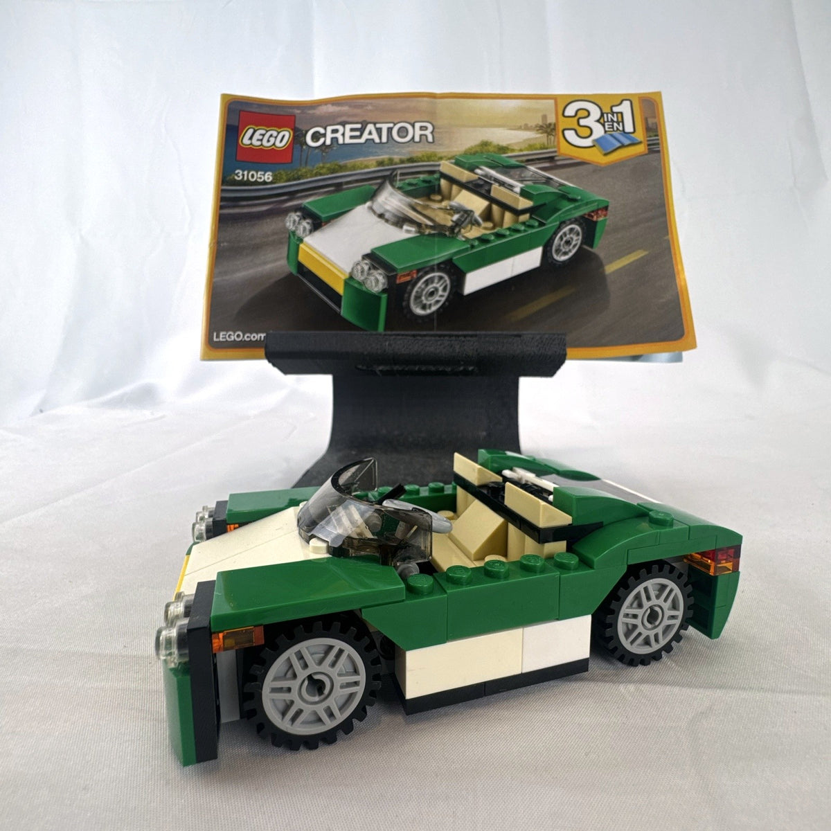 Assembled LEGO Creator 31056 Green Cruiser convertible sports car with instruction manual
