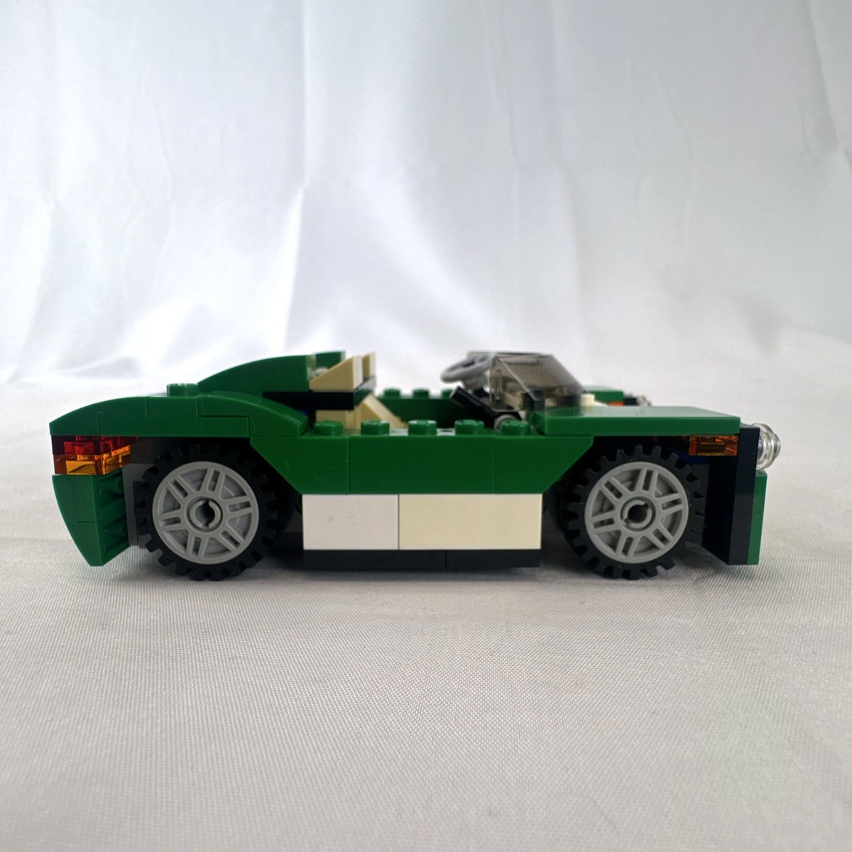 Assembled LEGO Creator 31056 Green Cruiser convertible sports car with instruction manual