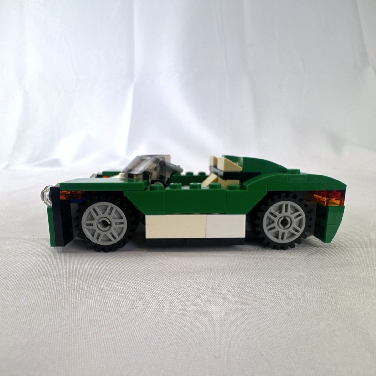 Assembled LEGO Creator 31056 Green Cruiser convertible sports car with instruction manual
