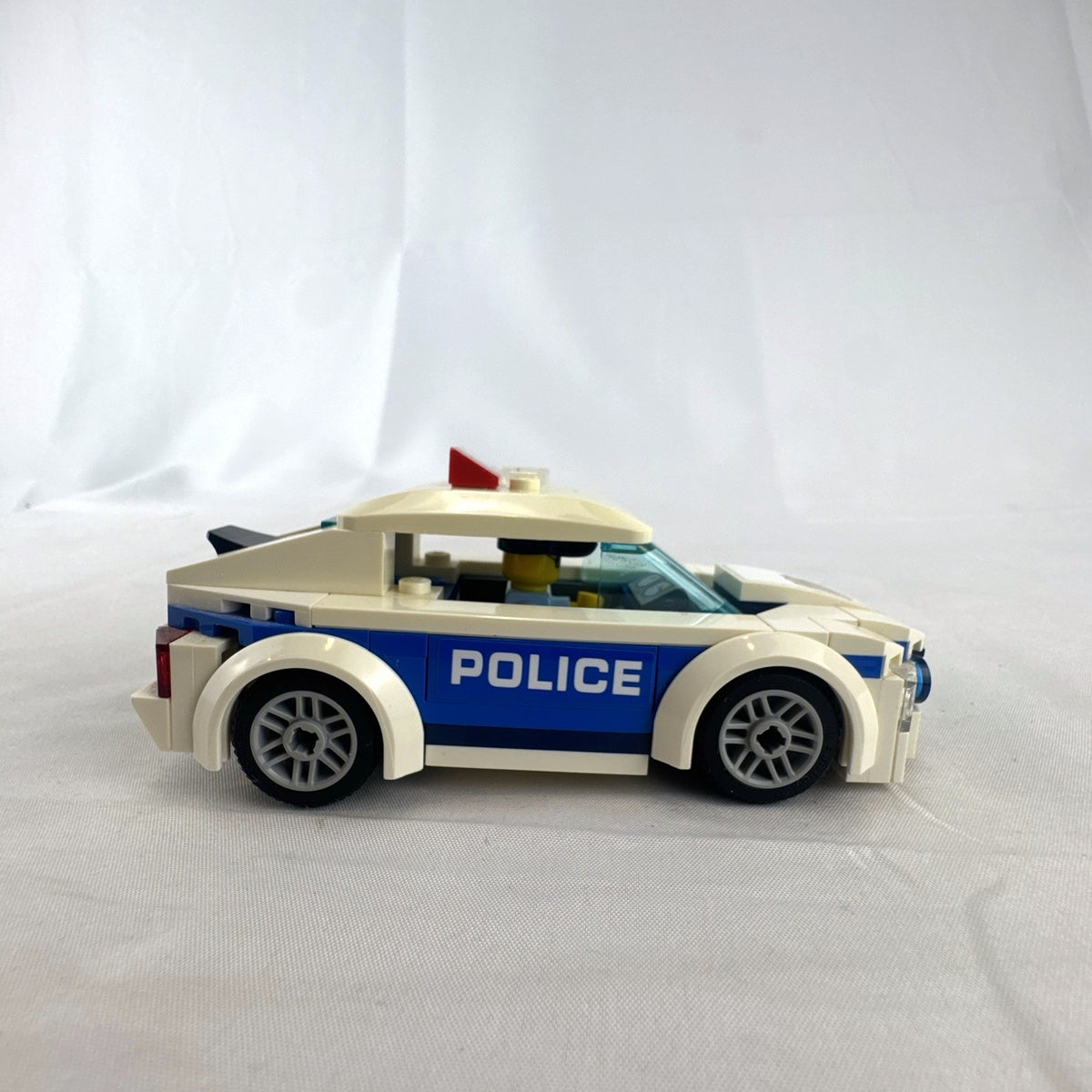 LEGO City Police Patrol Car set 60239 with police officer minifigure and instruction manual