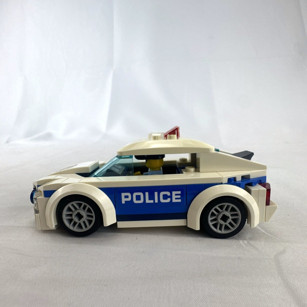 LEGO City Police Patrol Car set 60239 with police officer minifigure and instruction manual
