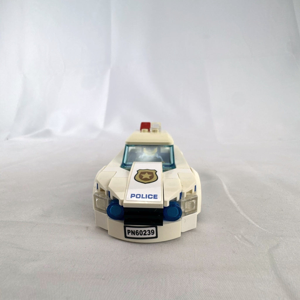 LEGO City Police Patrol Car set 60239 with police officer minifigure and instruction manual